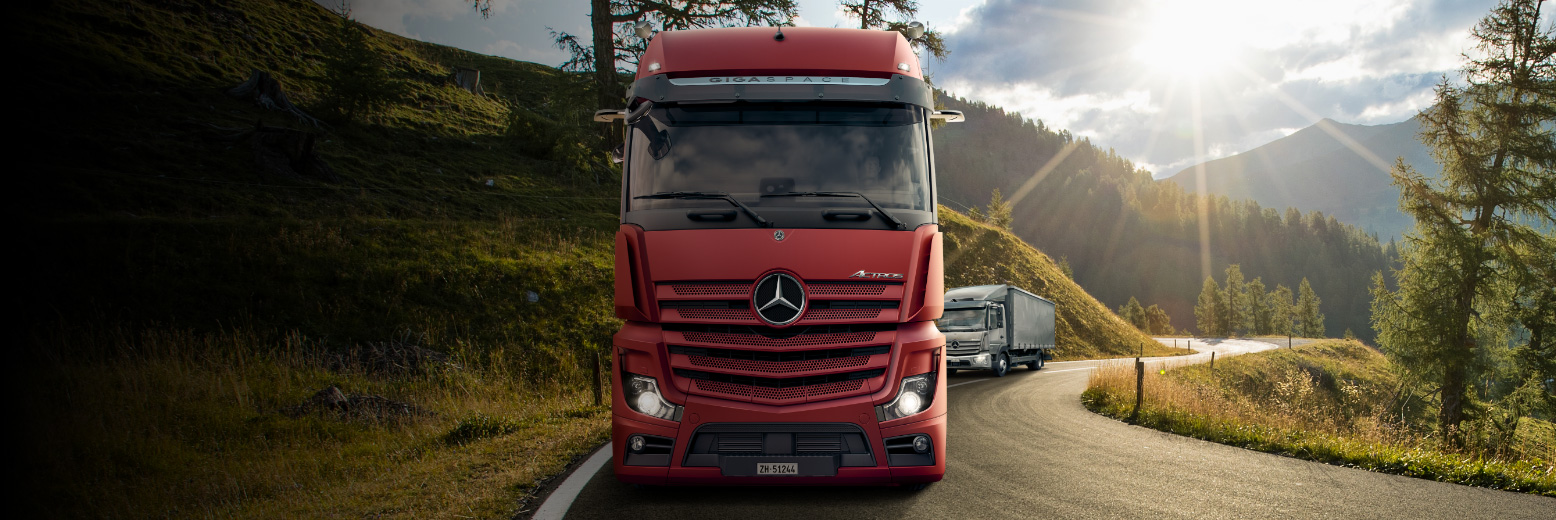 Actros and Atego on a beautiful road in great nature